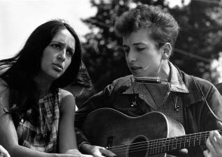 <b>Bob Dylan (right) was 22 years old when he appeared with Joan Baez on Aug. 28, 1963 during a civil rights March on Washington where Martin Luther King Jr. gave his “I have a dream” speech. Sixty years later, Dylan is on his latest live tour that includes a Nov. 16th appearance at the Beacon Theater.</b> Photo: National Archives and Records Admin/Wikimedia Commons