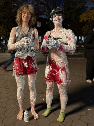 Performers Ella Berzins, 22, and Virginia Murphey Boncek, 21, covered in shaving cream.