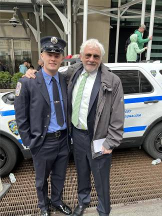 Firefigther Ruairi J. Kelly (left) with his dad Keith J. Kelly at the start of the St. Patrick’s Day Parade.