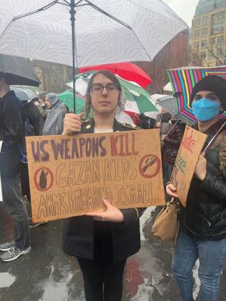 Amber McCandless showed up to the protest in her U.S. Army service uniform.