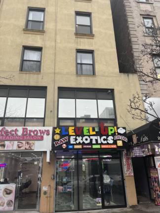 This smoke shop in Harlem was the scene of a robbery on Feb. 11 in which a 42 year man, Alfred Johnson, was murdered in the course of the robbery. The two suspects are still at large. Photo: Kay Bontempo