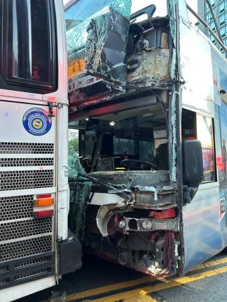 A collision between a tour bus that ran a red light and an MTA bus on July 6th on and E. 23rd Street and First Ave. sheared off the front of the tour bus after it rain a red light and rammed into an MTA bus. Photo: FDNY via Twitter