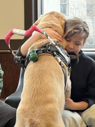 To encourage and support her during her recovery, Naomi Wood has parents as well as an older brother, and now Elroy, her furry best friend forever.