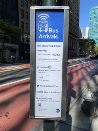 Bus sign indicates how to find out arrival times. Photo: Meredith Kurz