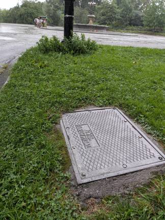 A metal plate engraved NYC Electrical just off the apprach to Bethesda Fountain.