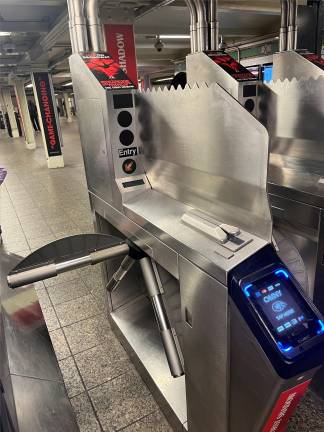Under the new 2025-2029 MTA Capital Program, 150 more stations will have new anti-fare evasion turnstiles like this one at the Times Square Station, with fins and paddles.