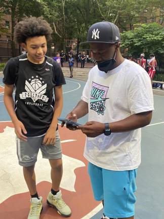 Andrew Blacks (right) with Craig Yancey, a middle-school student from Harlem. Photo: Stephan Russo