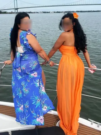 A photo from boat tour charter company Zeus Luxury Rental shows two women aboard a boat much larger than the vessel which capsized, with the Whitestone Bridge nearby.