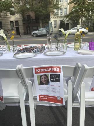 Empty chair for 13 year-old Alma Or at the Shabbat table.