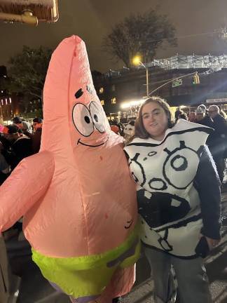 Bree and Soph in their Patrick Star and Doodlebob costumes from the popular animation show “Spongebob,” getting ready to watch the parade.
