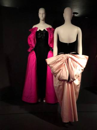 Victor Edelstein’s black-velvet/pink-satin gown (1987) with giant bow suggests its wearer is a present. Photo: Val Castronovo