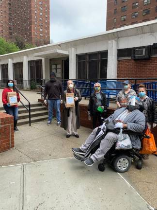 Brewer with Stanley M. Isaacs Neighborhood Center staff and clients.