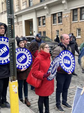 Union members hold signs at the memorial on March 25, 2023 to commemorate the 112th anniversary of the fire. <b>Photo: Kay Bontempo.</b>