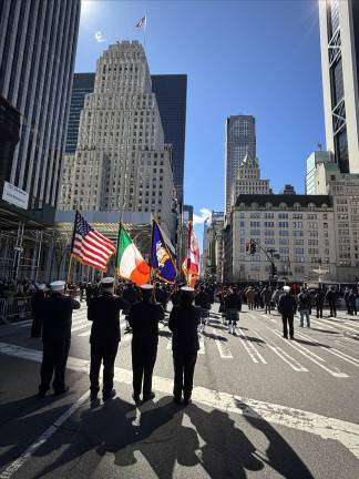 Precisely at 1 p.m., all 120,000 marchers and bands and hundreds of thousands of spectators turned south to where the Twin Towers once stood to observe a moment of silence for the 2,700 who died on 9/11, 2001.
