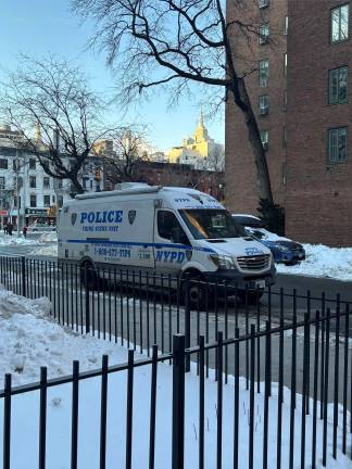 A NYPD crime scene van is parked in the First Ave. Loop Rd in Stuyvesant Town near 18th St. on Jan. 29. Police have identified a suspect who is also wanted in connection with past incidents. He is still on the loose.