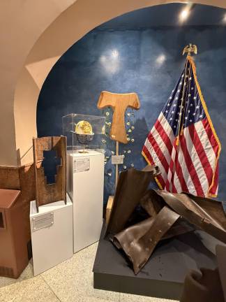 The new 9/11 memorial at St. Francis of Assisi also includes the damiano cross, Mychal Judge’s FDNY dress helmet, a Franciscan tau and twisted steel from the World Trade Center.