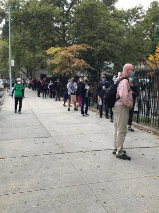 Voters lined up Saturday on 101st Street between Columbus and Amsterdam Avenues for the polling site on 102nd Street. Photo: Jeanne Straus