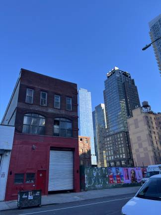 The vacant lot abutting Central Park Carriage (front, right) has just been acquired by a developer.