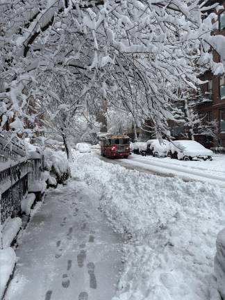 A fire engine answers the call on Central Park West.