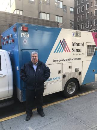 Joseph J. Davis, the director of Emergency Medical Services for the Mount Sinai hospital system, stands in front of one of the two dozen ambulances he oversees in a recent photo at Mount Sinai West on West 59th Street. Photo: Mount Sinai Health System