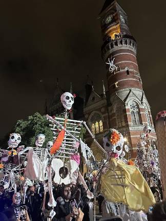 Large skeleton figures march down 6th Avenue exciting the crowd. Skeletons were big at this year’s parade.