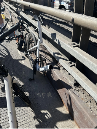 Image of the broken bike and electric scooter following the collision.