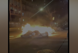 Two police cars were set on fire on West 29th Street. <b>Photo: ABC 7.</b>