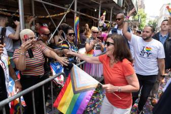 <b>Gov. Kathy Hochul Greets Revelers at the Pride March. Hochul recently signed a Trans Safe Bill sponsored by NY State Senator Brad Hoylman-Sigal and Assemblyman Harry Bronson.</b> Photo: Governor’s Office via Flickr