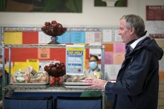 Mayor Bill de Blasio visits the Meal Hub at P.S.1 Alfred E. Smith School in Manhattan on April 7 to thank school food services workers who provide families with “Grab and Go” meals.