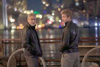 Long time plays George Clooney (left) and Brad Pitt, who are starring in Wolves, a new thriller for Apple Original Films, captured while filming at the South Street Seaport. Photo: Steve Sands/New York Newswire