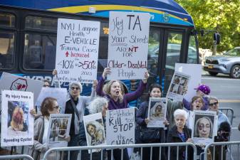 Protesters gather outside Transportation Alternatives’ annual fundraiser to call for stricter regulation of e-bikes and other micromobility devices.