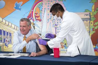 Mayor Bill de Blasio receives a booster shot from Dave A. Chokshi, Commissioner of the NYC Department of Health and Mental Hygiene, on Monday, October 25, 2021. Photo: Ed Reed/Mayoral Photography Office