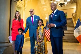 <b>Mayor Adams (far right), Chancellor David Banks (middle) and Assembly member Jenifer Rajkumar (far left) at the City Council meeting on Monday, June 26 to make Diwali an official school holiday.</b> Photo: Ed Reed Mayor Adams Photography Office.