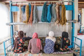 Afghan women weavers. Photo: Naimat Rawan, courtesy of KCEC