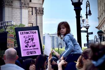 Tens of thousands packed Foley Square before a march to Battery Park Friday as park of the Climate Strike NYC, a movement led by 16-year-old Swedish climate activist Greta Thunberg.