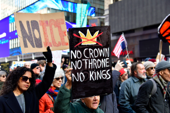 Handwritten signs proclaiming “No Ice” and “No Kings” were in abundance as were American flags, some flying upside down in an international distress symbol.