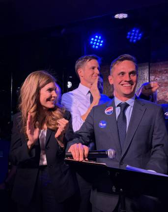 Wilson, pictured at his victory party on April 28, had the support of Council Speaker Julie Menin (left) and State Senator Erik Bottcher (back, center).