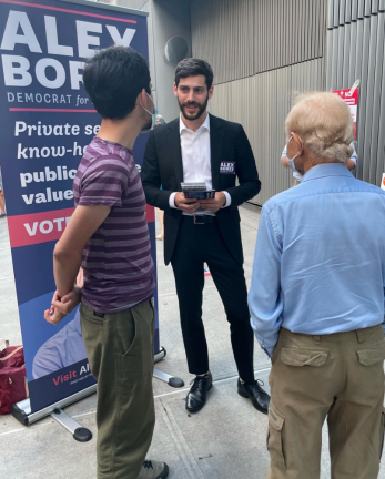 Alex Bores (center) on the campaign trail leading up to the conclusion of the Democratic primary. Photo via Bores’ Twitter