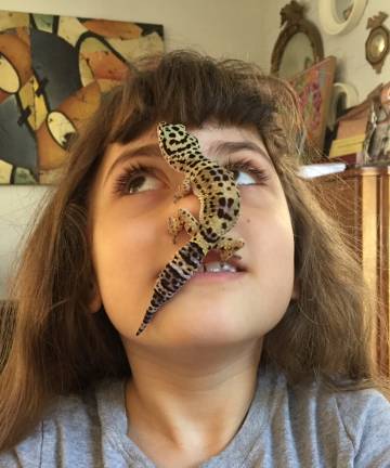Zoe Sullivan and her leopard gecko, Roxie, get some face time. Photo: Alison Lynn