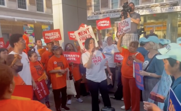 Protesters gather outside the RGB meeting at El Museo del Barrio, advocating for a rent freeze on June 30.