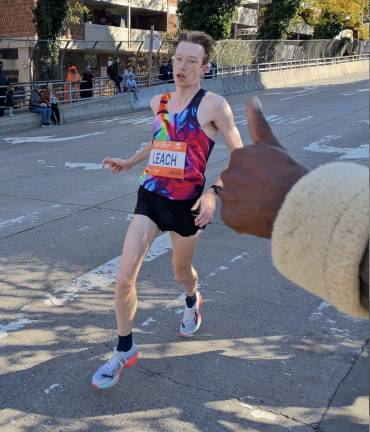 Matthew Leach, eventual first men’s finisher from New York City, gets thumbs up from Ernest Connors.