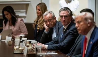 Health and Human Services Secretary Robert F. Kennedy Jr. (center) joins President Donald Trump at a Cabinet meeting in the White House, April 10.
