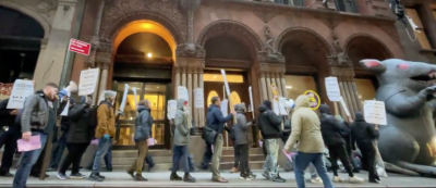 Workers with 32BJ SEIU’s New York Metro residential division conducting a brief strike at 56 Pine St. The union said that cut breaks were restored after the labor action, but that a first-time contract was still being negotiated with management.