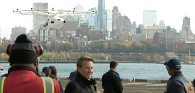 (Far right): Mayor Eric Adams watches as an eVTOL takes flight at the Downtown Manhattan Heliport.