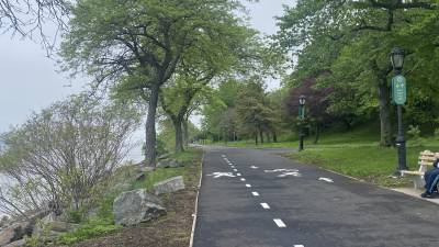 Cherry Walk on the UWS can welcome visitors again along newly repaved roadway that aims to keep bikers and pedestrians safe by separating them. The iconic blossoms on cherry trees that line this 1.25 mile portion of Riverside Park won’t be visible again until next season as unusually windy weather in April cut short the bloom season this year. But most park goers were happy the days of detours were over.