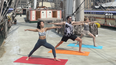 Participants practicing yoga asanas on the 130-year-old vessel, earlier this summer.