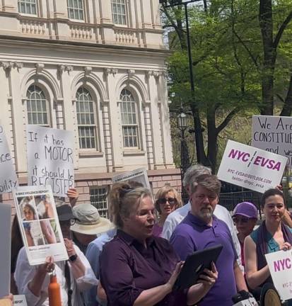 Janet Schroeder, who leads the Electric Vehicle Safety Alliance, rallied outside City Hall on April 16 for the passage of Priscilla’s Law. It would force the registration of e-bikes and other e-vehicles.