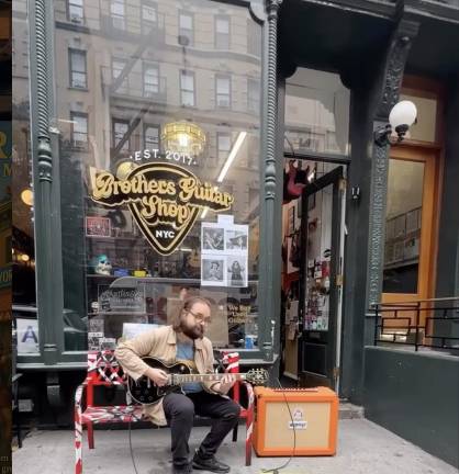 Brothers Guitar Shop stoop concert.