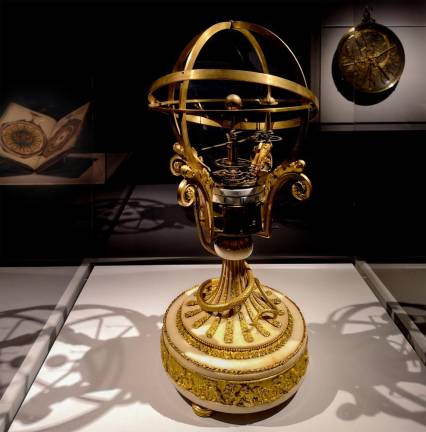 A French orrery clock, c. 1790, in gilded bronze, marble, brass and enamel, modeled planetary motions in three dimensions.