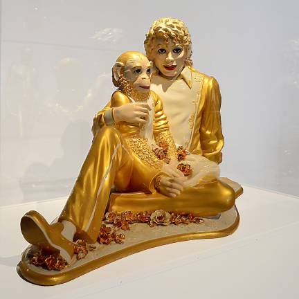 Jeff Koons combines high and low while reflecting on the opulence of porcelain in his "Michael Jackson and Bubbles" from 1998. Photo: Adel Gorgy